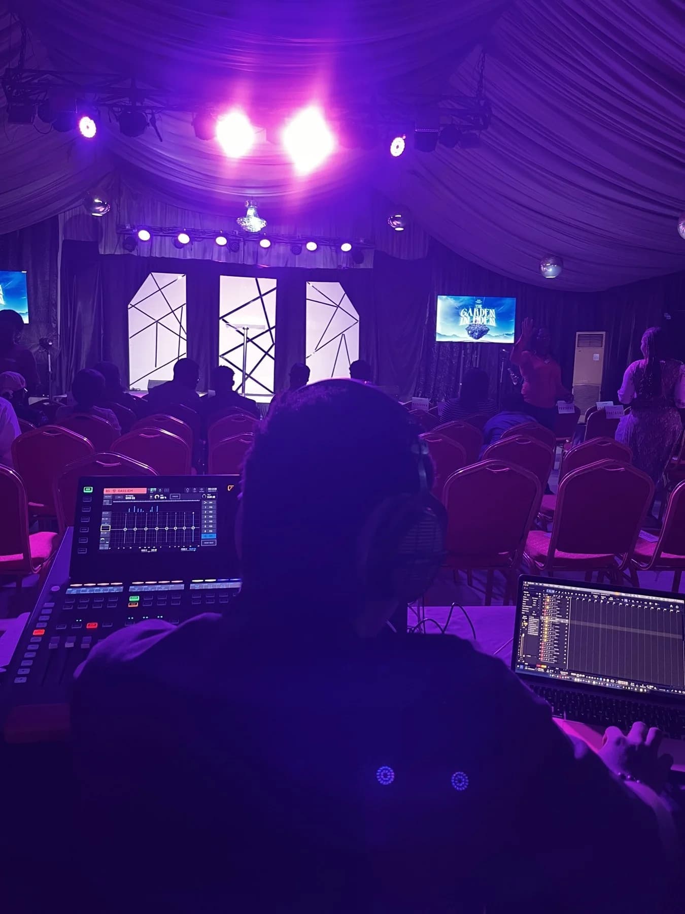 A front-of-house operator working in a live venue
